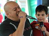 Adults and kids sang karaoke together. © Anie Miles