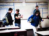 After class, kids practice “moving forward” and past their mistakes on the broken line of tape. © Robert Gary