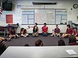Ms. Enger instructs the students before a group discussion of the skits. © Robert Gary