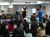 An appreciative student gives a standing ovation. © Robert Gary