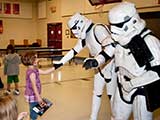 The kids got to meet and shake hands with the Stormtroopers after picking out their comics. © Denise Gary