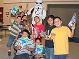 The kids gathered in groups to pose with the Troopers. One boy tried in vain to give rabbit ears to TK-2035! © Denise Gary
