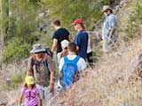 The youngest Jamboree hiker passes the first group on their way down.
