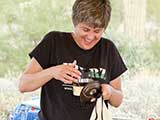 Denise has fun with a prize from Wild Birds Unlimited.