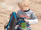 This little boy was thrilled to win an REI hydration pack just like his dad's!