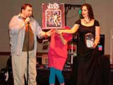 Mike Dougherty and Heather Fagan help Denise give away Geek prizes. © Bruce Matsunaga