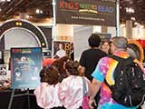 Con-goers surround the KNTR booth on Saturday morning. © Bruce Matsunaga