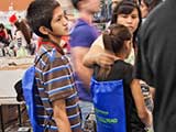 KNTR goodie backpacks, sponsored by our friends at Bookmans, were given out to kids. © Robert Gary