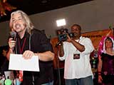 Dominic Ross of Big Brain Pictures films while PJ auctioneers. © Bruce Matsunaga