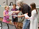 Kids act out a scene from <em>The Softwire: Virus on Orbis 1</em>. © Bruce Matsunaga