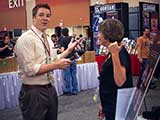 Denise points to Steven Riley when asked what is the craziest thing she has seen at the convention. © Robert Gary