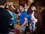 Phoenix Comicon Programming Director Joe Boudrie and daughter Gemini stop by the booth. © Bruce Matsunaga