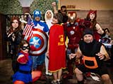 Denise shows off her Honorary Arizona Avengers cape, received at last year's KNTR Geek Prom. © Bruce Matsunaga