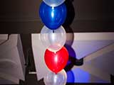 Balloon arch over stage © Robert Gary