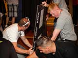Project Hero members assemble the T.A.R.D.I.S. photo backdrop before the event begins. © Bruce Matsunaga