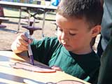 First, the kids had to sign a pledge pumpkin to read 30 minutes per day, five days per week. © Denise Gary