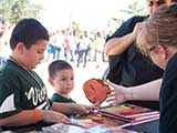 Then, they handed in the pledge pumpkin. © Denise Gary