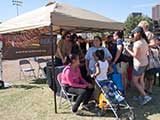 Our booth was inundated by kids who wanted books. © Denise Gary