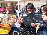 Some of the kids check out the magazines. © Denise Gary