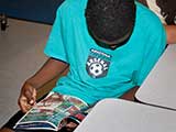 Kids Need to Read is dedicated to empowering the students of CFA with the enlightenment and self-respect that reading can bring to their lives. © Denise Gary