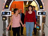 Denise escorts Janette underneath the Geek Arch.