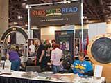 Getting the morning underway at the KNTR booth. © Bruce Matsunaga