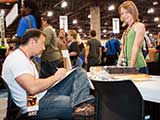 Steven begins drawing another caricature. © Bruce Matsunaga