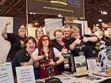 Debb celebrates with KNTR volunteers over the sell-out of the KNTR Geek Prom! © Bruce Matsunaga