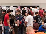 Contributions by convention artists poured in and overflowed onto tables for the art auction, which partially benefited KNTR. © Bruce Matsunaga