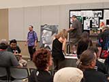 Auction attendees look over the pieces and wait for the auction to begin. © Bruce Matsunaga
