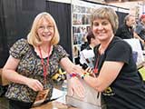 Cindy Owen and Denise enjoy their Geeksages. © Carl Wagner
