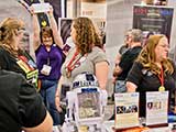 Volunteers celebrate KNTR Geek Prom ticket sales. © Robert Gary