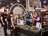 Rachael and Nacole have fun at the KNTR Geek Prom table. © Robert Gary