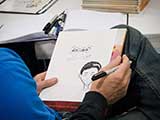 Steven begins one of many special order caricatures. © Robert Gary