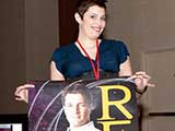Tina Worley gets things ready at the auction table. © Bruce Matsunaga