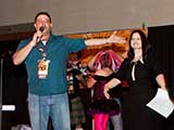 Adam Goldman and Isabelle Mangouni of Mojo-Bone Software Studios introduces their Mega Auction Package. © Bruce Matsunaga