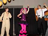 Denise dances to “Two Tribes” with two Geeks. © Bruce Matsunaga