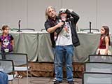 PJ introduces the vastness of space through a hands-on demonstration. © Bruce Matsunaga