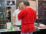 PJ is surprised by the first secret fan of <em>Devious Beings</em>. © Robert Gary