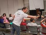 Author and illustrator Steven Riley greets kids awaiting his presentation, “The Story of Stories and Then Some!” © Robert Gary