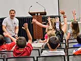 Steven gets the kids excited from the beginning with a game. © Robert Gary