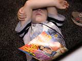 A little one decides to take a break next to our booth with his Highlights for Children magazine. © Robert Gary