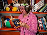 Kids really enjoyed the Reading Corner in the art room, sponsored by Bookmans and Kids Need to Read. © Bruce Matsunaga