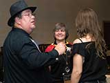 Denise talks with event presenters Randy DeVault and Angie Ramey of Lupine Entertainment. © Robert Gary